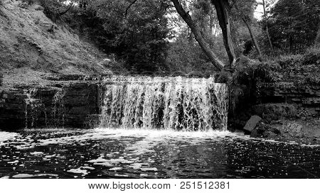 Small Waterfall On Sablinka River In Leningrad Region, Russia. Black And White.