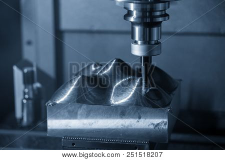 The Cnc Milling Machine Cutting The Mold Part In Roughing   Process With The Index-able Radius End-m