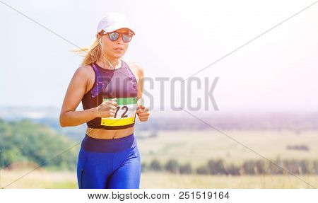 Young Slim Woman Running Trail Race Contest.