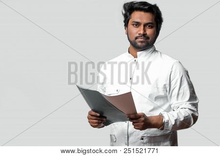 Experienced Doctor From India Holding Folder And Documents. Hardworking Hindoo Doctor. Copyspace. Sk