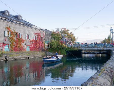 Otaru, Japan - October 19, 2017 : Unknown Tourists On Otaru Canal Cruise, Bright Beautiful Autumn Da