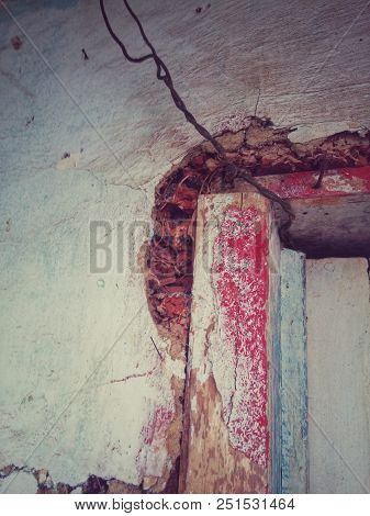 The Corner Of A Crimson Reddish Brown Old Door In A Very Antique Traditional Bahareque House In Coun