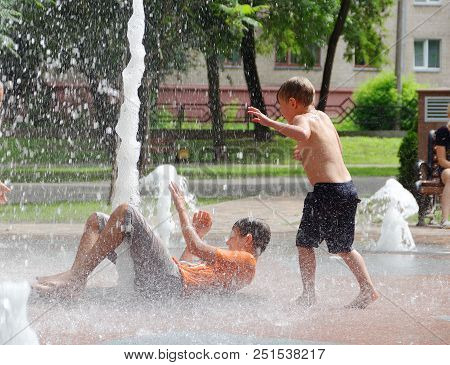 Gomel, Belarus Children Bathing In The Fountain. Square Named After Gromyko