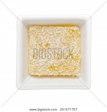Traditional Kueh Sago Covered With Coconut Shreds In A Square Bowl Isolated On White Background;