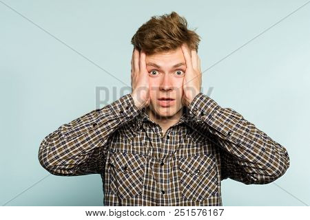 Omg Unbelievable Shock Amazement. Dumbfounded Man With Open Mouth Clutching His Head. Portrait Of A 