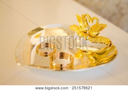 Wedding Symbols Two Rings On Golden Heart-shaped Tray - Love, Family, Celebration, Ceremony Concept