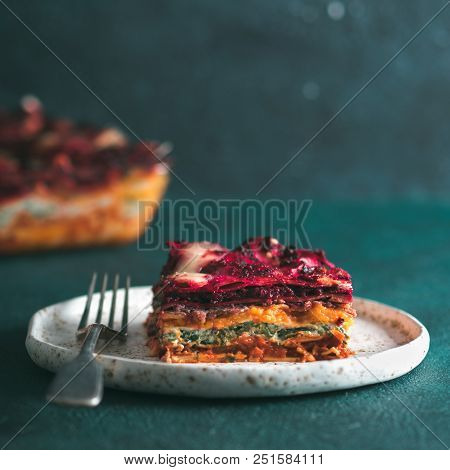 Vegetable Packed Rainbow Lasagne On Green Background.ideas And Recipes For Healthy Vegetarian Dinner