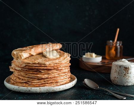 Stack Of Traditional Russian Pancakes Blini On Black Background With Copy Space. Homemade Russian Th