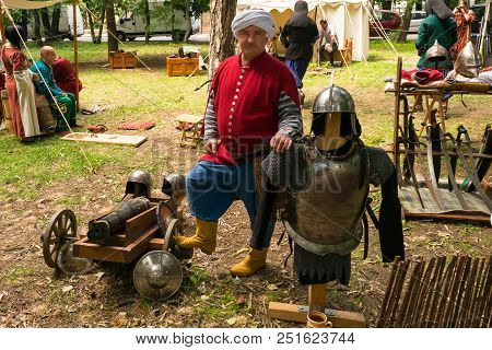 Ploiesti, Romania - July 14, 2018: Actor Dressed Up Ottoman Turk Warrior Poses Surrounded By Medieva