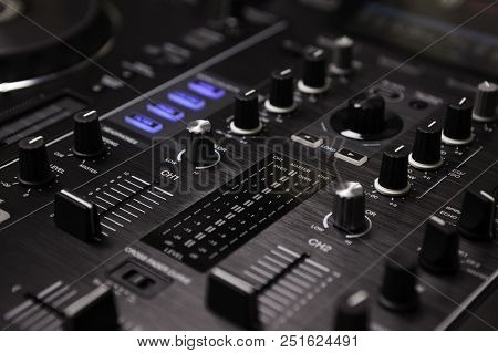 Dj Mixer On Nightclub On Party In Nightclub With Colored Lighting Effect Disco Lights