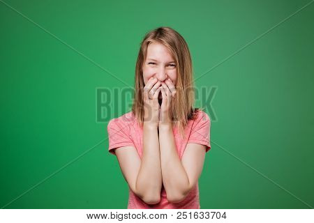 Lovely Shy European Woman Lauging And Closing Her Face With Nads. She Is Shy To Hear Compliments