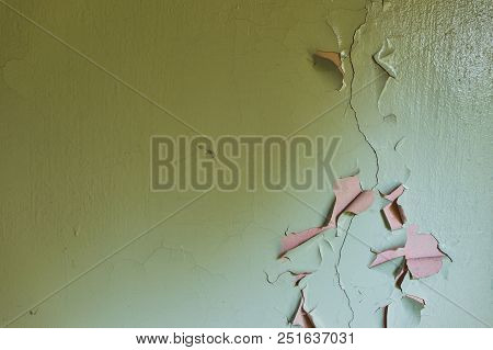 Grunge Cracked Wall Paint Peeling Off. Yellow And Cyan.