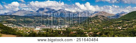 The City Of Gap In The Hautes Alpes With Surrounding Mountains And Peaks In Summer. Panoramic. South