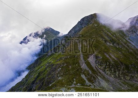 Summer Landscape With High Mountains And Clouds In A Summer Day