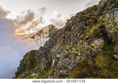 Summer Landscape With High Mountains And Clouds In A Summer Day