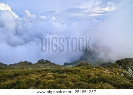 Summer Landscape With High Mountains And Clouds In A Summer Day