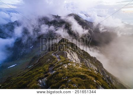 Summer Landscape With High Mountains And Clouds In A Summer Day