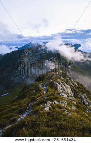Summer Landscape With High Mountains And Clouds In A Summer Day