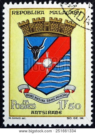 Malagasy - Circa 1964: A Stamp Printed In Malagasy, Madagascar Shows Antsirabe, Coat Of Arms, Circa 