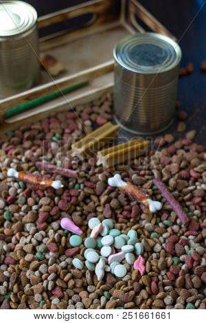 Vitamin Tablets For Pets On Hip Of Dry Pet Food