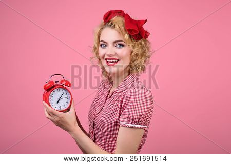 Smiling Pin-up Woman Holding Clock. Happy Pin Up Woman In Red Dress Holds Red Clock. Retro Style. Pi