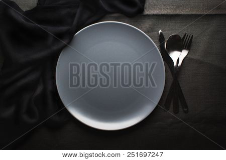 Top View Of A Restaurant Table With Plate, Knife, Fork And A Napkin In Luxurious Restaurant