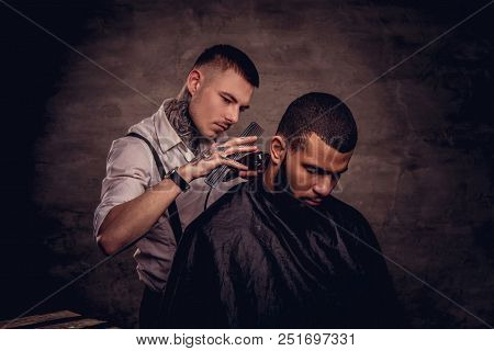 Bearded African American Hipster Guy Getting A Haircut By An Old-fashioned Tattoed Professional Hair