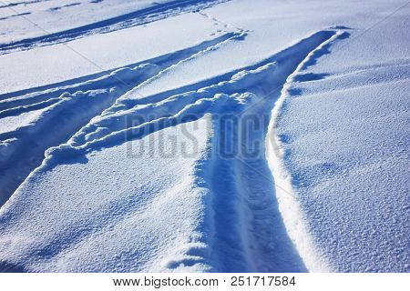 Traces Of Car Tires On The Snow