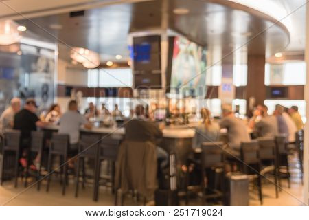 Abstract Blurred People Dining In At Airport Sport Bar