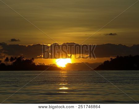 Sunset With Ocean Tropical Isnald And Palms