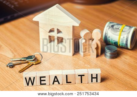 The Family With Money Is Standing Near Their House. Concept Of Wealth Life And A Happy Well-endowed.