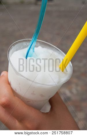 Granita To Take Away In A Plastic Cup With Blue Spoon And Yellow Drinking Straw