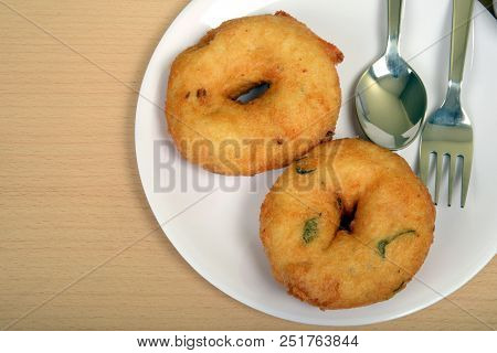 Sambar Vada Or Medu Vada Is A Very Popular South Indian Food On Wooden Background