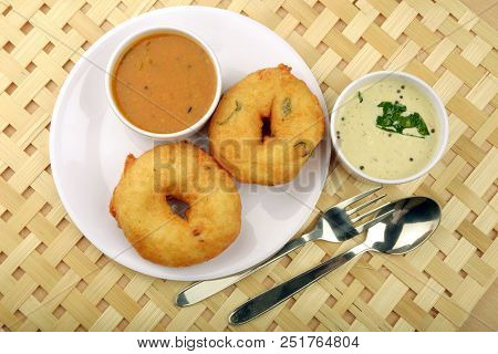 Sambar Vada Or Medu Vada Is A Very Popular South Indian Food On Wooden Background