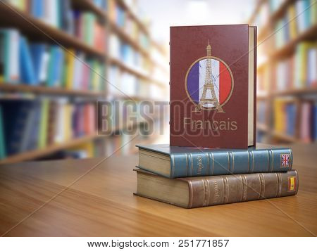 Learn French concept. French dictionary book or textbok with flag of France and Eiffel tower on the cover in the library. 3d illustration