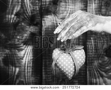 Female Hand Smeared In Golden Paint Or Glister Holding Handmade Pink Polka Dots Selective Focus Vale