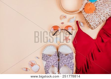 Summer Fashion Flatlay With Gradient Round Sunglasses, Straw Bag With Pompoms And Red Swimsuit With 