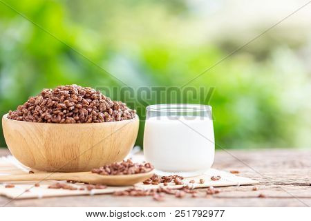 Breakfast Cereal, Puffed Rice With Cocoa In Bowl And Glass Of Milk On Wooden Table