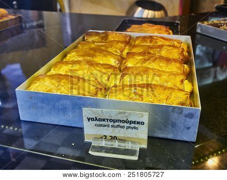 Athens, Greece - June 29, 2018. Galaktoboureko, Typical Greek Sweet In A Storefront Of A Greek Pastr