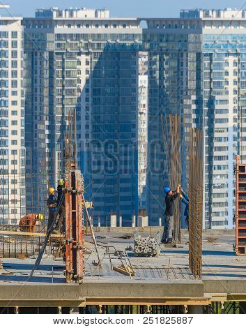 Kiev, Ukraine - October 01, 2015: Construction Workers At Work On A Top Of Building. Kiev Is The Cap