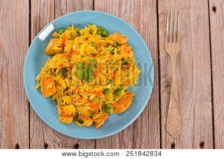 Nasi Goreng With Spices On Wooden Table.