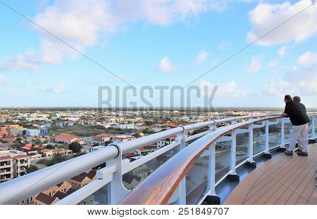 Kralendijk, Bonaire - 12/16/17:  A Senior Couple Standing On The Deck Of A Cruise Ship Enjoying The