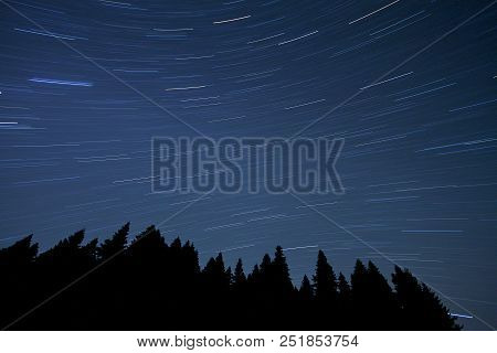 A View Of The Stars Of The Milky Way With A Mountain Top In The Foreground. Night Sky Nature Summer 