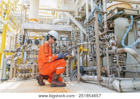 Mechanic Operator Check Lube Oil And Seal Gas Systems Of Gases Compressor On Offshore Central Proces