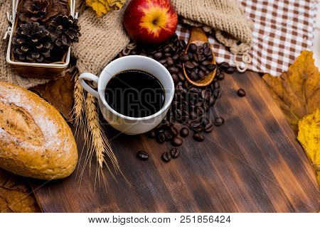 Cup Of Hot Coffee With Toast For Autumn Season Warm Drink. Fall Harvest Cornucopia. Copy Space On Wo