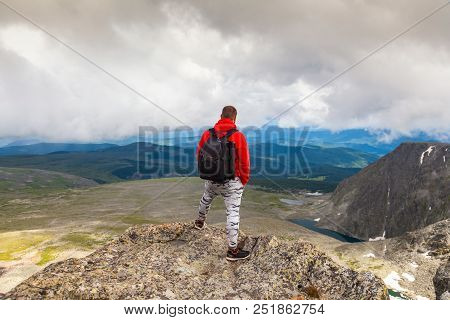 Man Hiker Enjoy The View At Sunset Mountain Peak Cliff.photographer Traveler On  High Mountaint  Sty