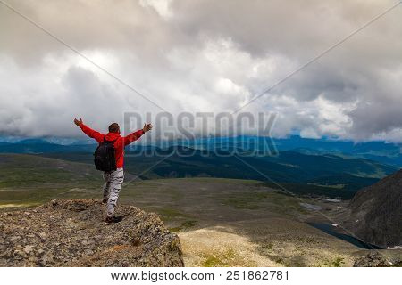 Man Hiker Enjoy The View At Sunset Mountain Peak Cliff.photographer Traveler On  High Mountaint  Sty