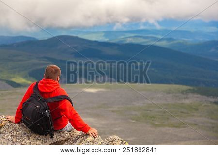 Man Hiker Enjoy The View At Sunset Mountain Peak Cliff.photographer Traveler On  High Mountaint  Sty