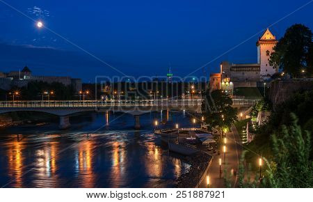 Night Panorama Of The Narva Castle With The Tower Vysokiy Herman, Narva, Estonia. In The Foreground 