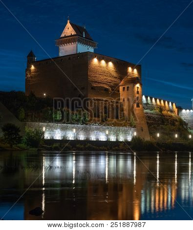 Night View Of Narva Castle With The Tower Of High Herman, Narva, Estonia. The Castle Has A Beautiful